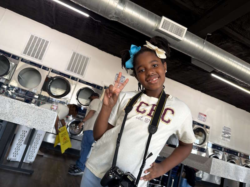 Spin City Laundromat Fun Filled Day covering peoples laundry expenses