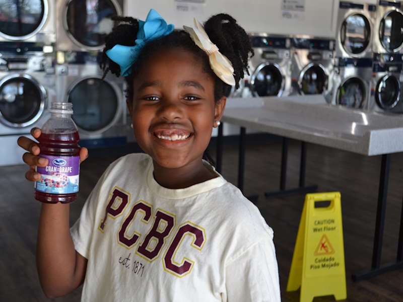 Spin City Laundromat Fun Filled Day covering peoples laundry expenses